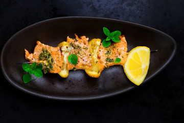 kebab from a salmon with a lemon.