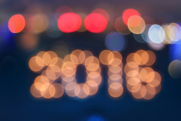 new year greeting card made of bokeh digits in shape of 2016