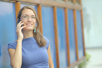 Young female talking on mobile phone 