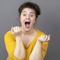 surprise and success concept - extrovert big woman expressing herself with both hands,screaming for surprise and happiness