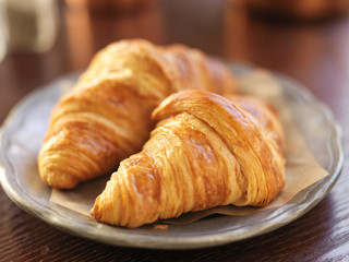 two croissants on plate and shot with selective focus