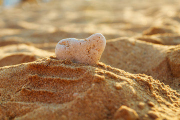 stone in the form of a heart in the sand on the beach    © stopabox