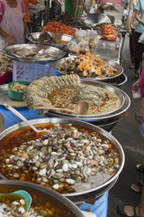 Street stalls sell all kinds of prepared food in Chinatown.Bangkok,Thailand