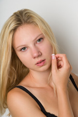Studio Portrait of a beautiful blond woman with long hair