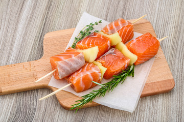 Raw salmon skewers