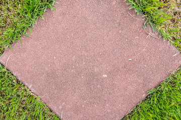 Green grass insert nearly brick floor top view