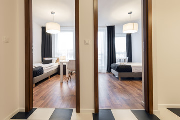 Two small, modern sleeping rooms interior design