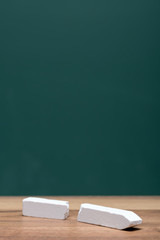 broken chalk in front of board
