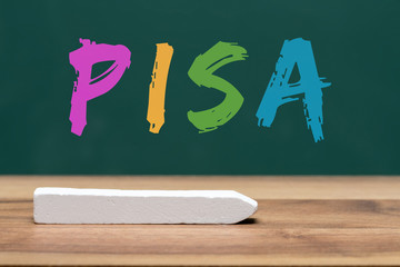 pisa study written on classroom board