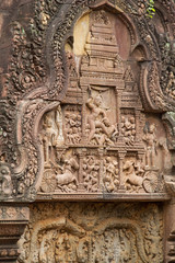 Detail of stone carving decoration in Banteay Srei showing war and battle scenes.near Seim Reap, Cambodia