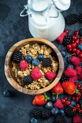Muesli granola nad fresh ripe berries, breakfast concept