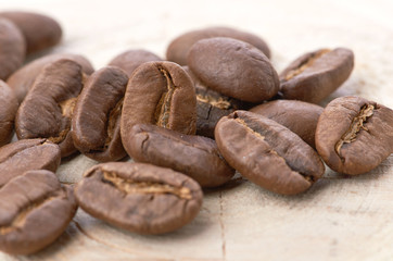 Coffee beans on wood background