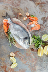 Fresh fish and seafood,lemon, mushroom and herbs for grilling