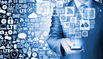 Business man using smart phone with social media icon set