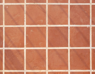 Terracotta floor square tile background texture
