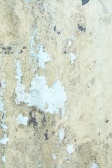 Flaky painted yellow metal grungy background texture.