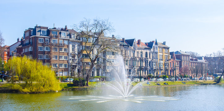 View over the artificial pond situated next to the flagey square in belgian brussels, where local citizens go to relax when sunny.