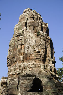 Spire at The Bayon buddhist temple with carved stone faces.near Siem Reap,Cambodia