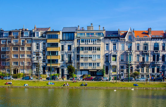 View over the artificial pond situated next to the flagey square in belgian brussels, where local citizens go to relax when sunny.