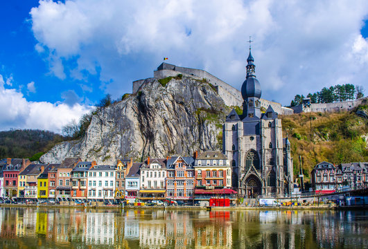 view over the beautiful landscape of dinant with citadel overlooking the city.