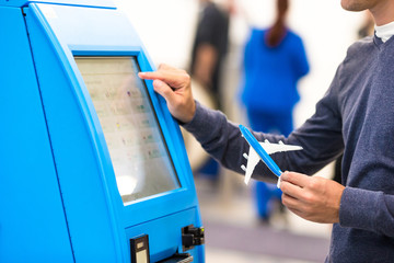 Close-up self-check-in for flight or buying airplane tickets at