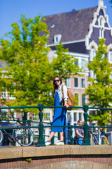 Young caucasian girl enjoy european vacation in Amsterdam