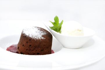 piece of cream cake decorated with chocolate and mint