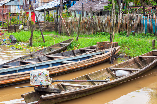 Canoes on the edge of the Amazon River in the town of Tamshiyacu near Iquitos, Peru