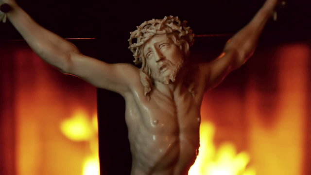 Christ in Cross With Flames Background Wider Shot.