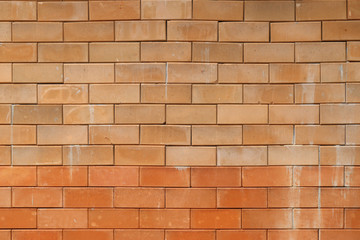 Fototapeta premium Red clay brick wall background.