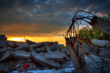 Apocalypse.Sunset over the wreckage of buildings.