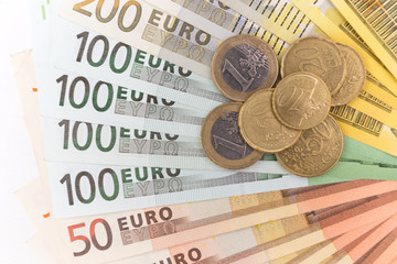 euro banknote and coin on white background