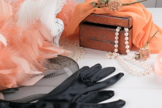 Women's retro accessories including velvet gloves and pearl necklace