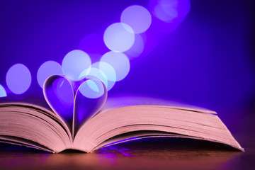 Book with low light and blue bokeh