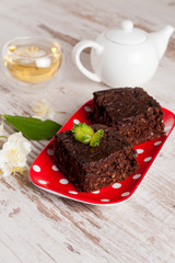 Pieces of chocolate brownies and jasmine