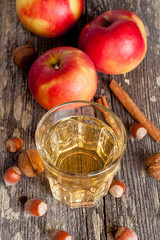 apple cider or juice in a glass, close-up