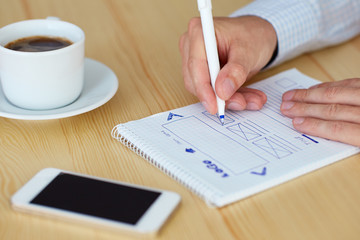 Man sketching web design