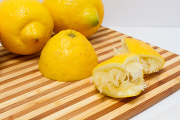Squeezed lemons on cutting board