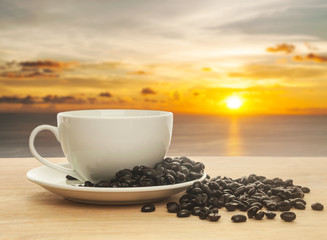 Fresh coffee in a white cup of coffee on wooden