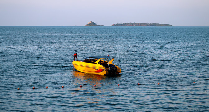 yellow motor boat