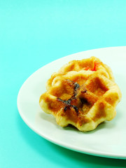 homemade sweet waffles with chocolate and strawberry sauce