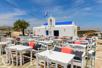 restaurant on the waterfront in picturesque traditional Greek village, Paros island, Cyclades, Greece.