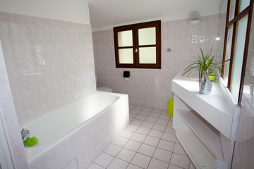 Nicely decorated modern white  washroom,