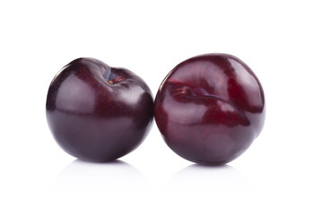 plums isolated on white