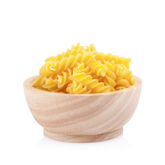 Pasta in wooden bowl, isolated on white background