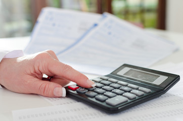 Woman accountant with calculator
