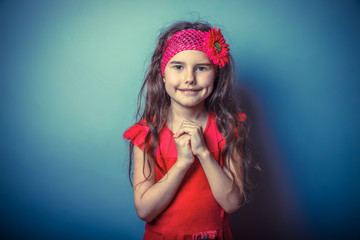 a girl of seven European appearance brunette in a bright dress f