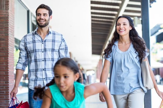 Happy family with shopping bags