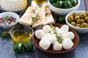 snacks - soft cheeses and pickles, close-up