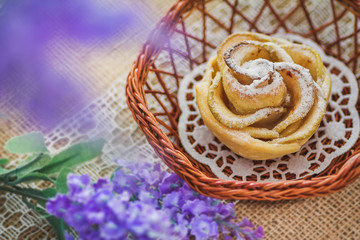 Close-up tasty homemade apple cake over sackcloth background in